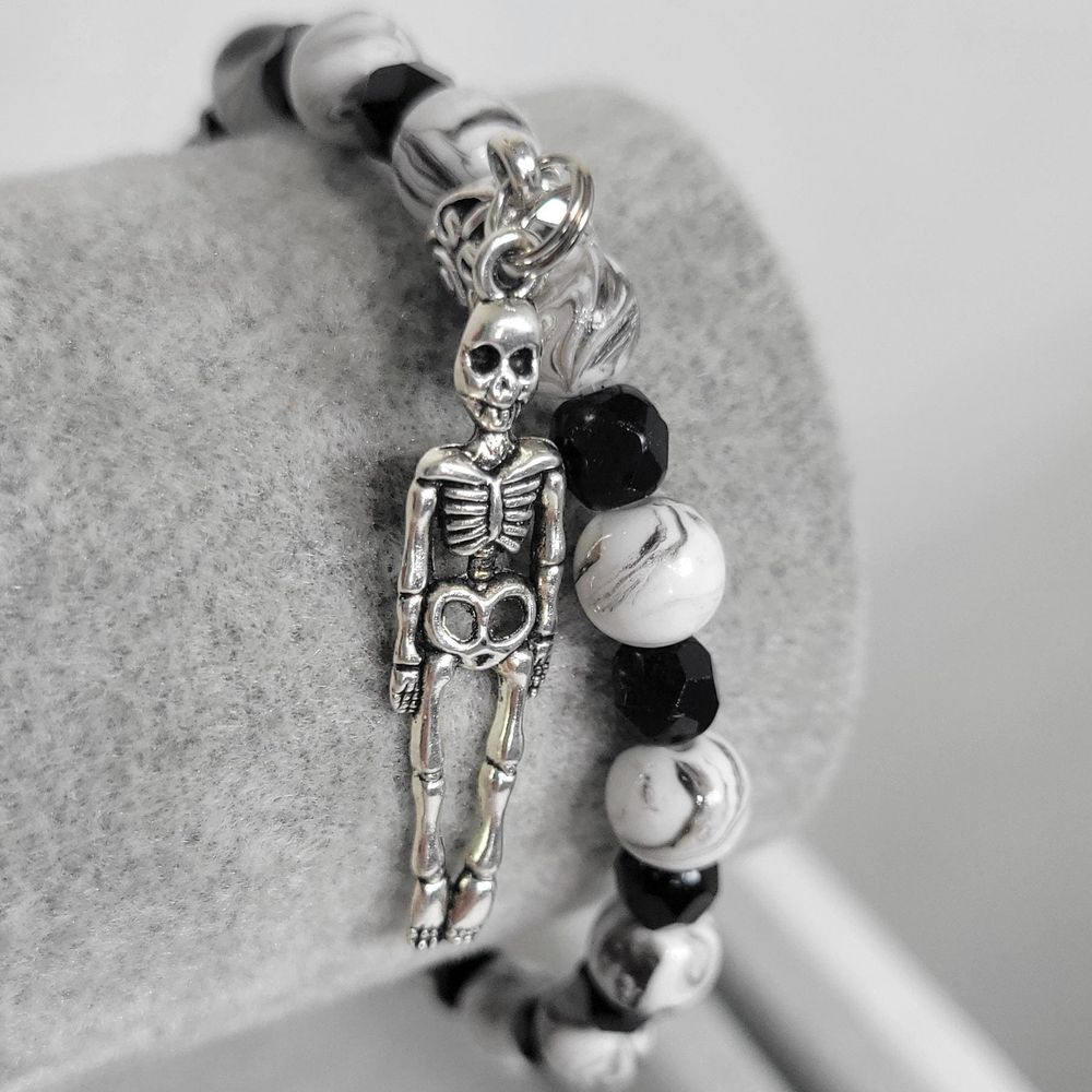 Hand crafted black & white crackle beaded skeleton charm bra...