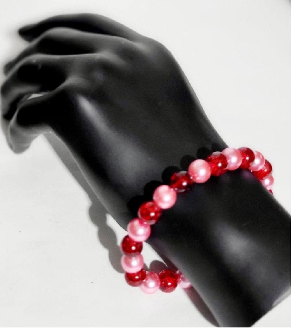 Cherry red & pearlescent pink stretchy glass beaded bracelet...