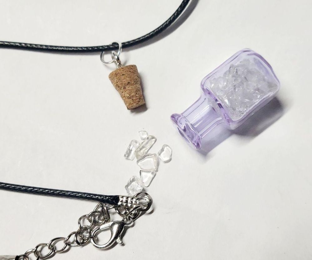 Hand crafted natural clear quartz crystal in mini wish bottl...